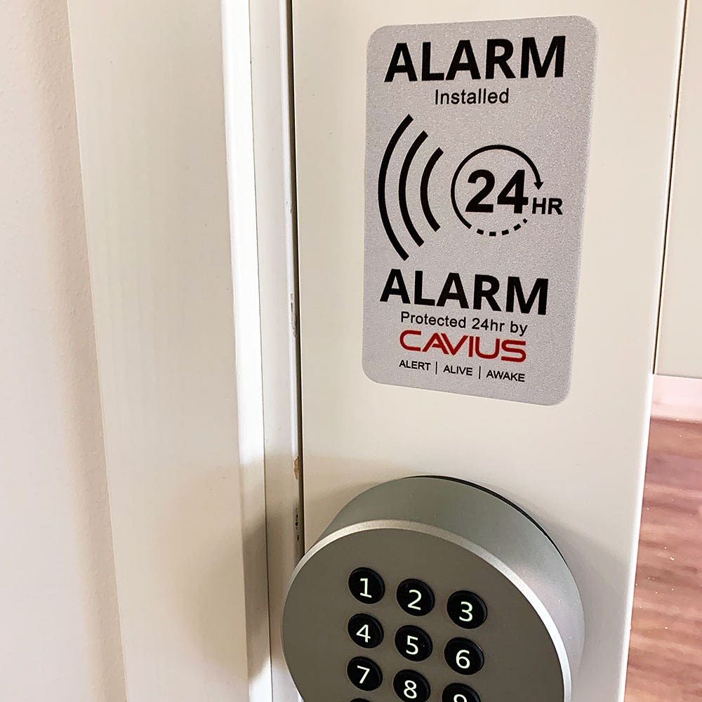 Larmskylt och stickers Cavius