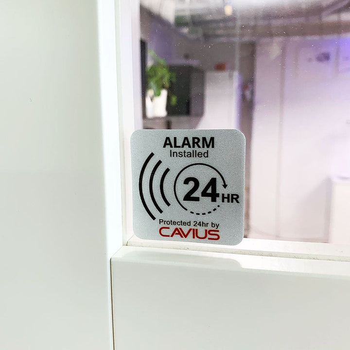 Larmskylt och stickers Cavius